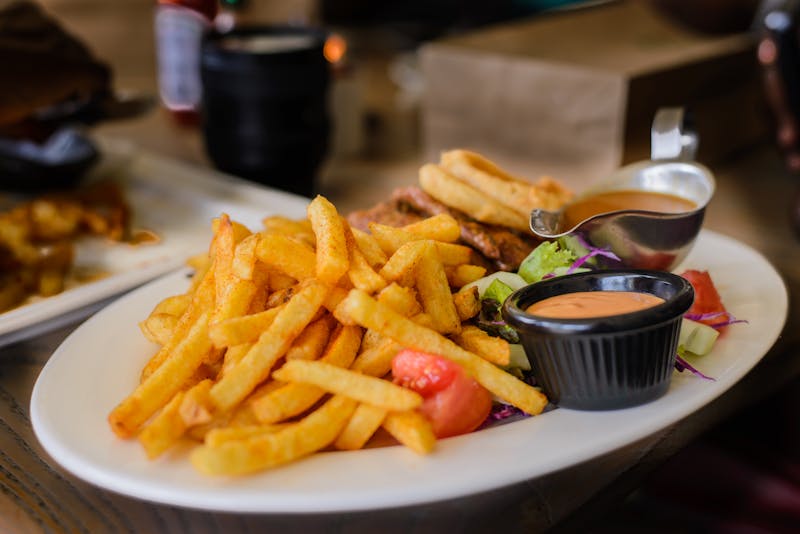 Crispy seasoned fries with dipping sauce